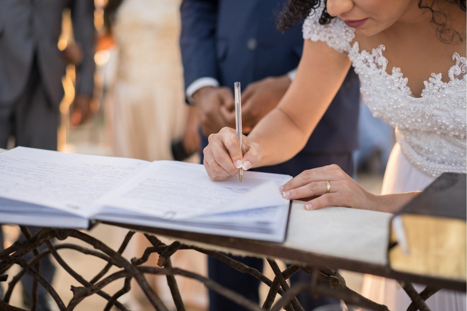 Couple signing after wedding